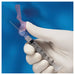 A 3ml syringe is held, with a safety cover partially removed, against a blue background.