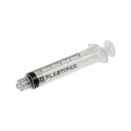 A clear plastic syringe, rests on a white background. The syringe displays "BD PLASTIPAK" printed on its barrel.