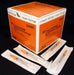 A box of BD 1/2cc LO-DOSE U-100 insulin syringes (28G ½) rests on a surface, with several individually packaged syringes arranged nearby. The box is orange and displays product information and lot number 329461.