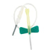 A winged infusion set, with a green plastic wing, is ready for use against a plain white background.