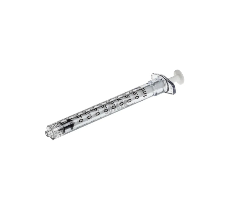 A clear, 1ml syringe lies on a white background. The syringe is empty.