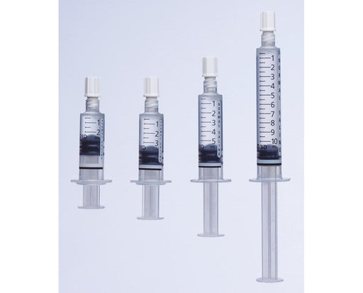 Four syringes of varying sizes stand upright, showcasing a gradation in volume, against a plain white background.