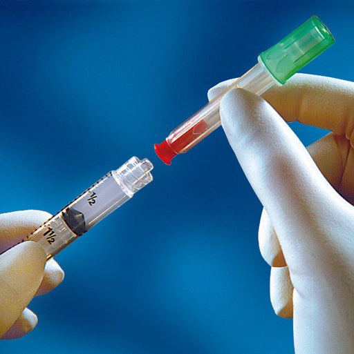 A syringe and a blood collection device are being connected by gloved hands against a blue background. The syringe shows markings "1/2" and "11/2".
