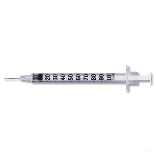 A 100-unit insulin syringe lies horizontally on a white background; it is ready for use.