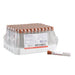 A box of capped test tubes sits on a white background; one tube lies outside the box. A small applicator is also present.