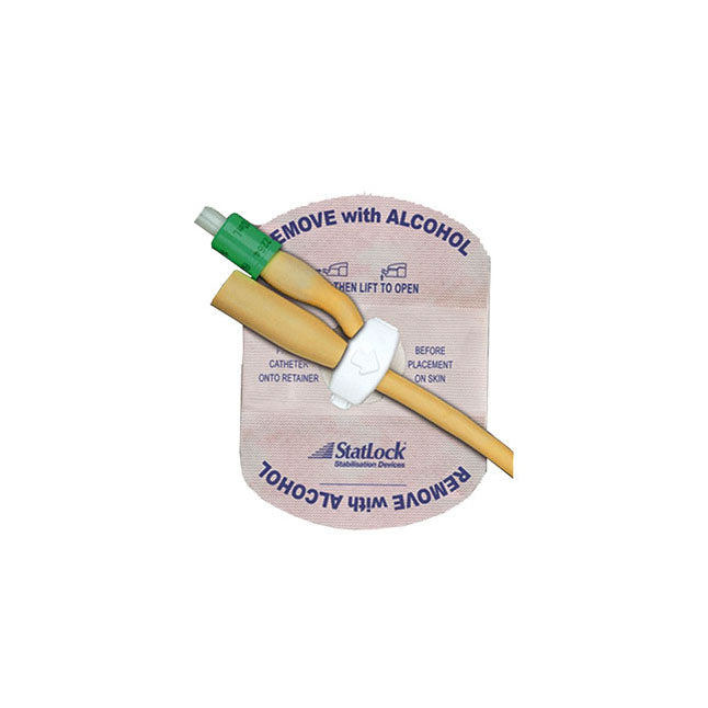 A catheter secures to a beige adhesive retainer; the instructions indicate alcohol removal before use.