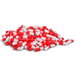Red and white capsules are piled against a black background.