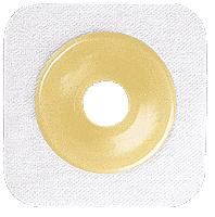 A beige, ring-shaped adhesive disk sits centered on a larger, square, off-white fabric patch.
