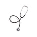 A black stethoscope lies on a white background; its chest piece rests on the lower right.