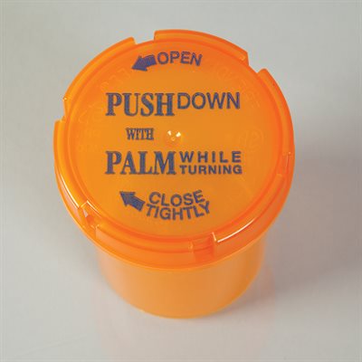 An orange plastic container with a screw-on lid is shown. The lid instructs: "PUSH DOWN WITH PALM WHILE TURNING," "OPEN," and "CLOSE TIGHTLY." The container sits on a plain, light surface.