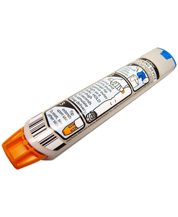 A beige auto-injector with orange end cap displays instructions for use; it lies on a white background.