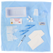 A medical kit containing various sterile supplies, including gauze, syringes, and other instruments, is laid out on a light blue surgical drape.