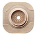 A beige, square ostomy wafer with a central, ringed aperture sits on a white background.
