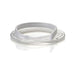 A clear plastic tubing, coiled, lies on a white surface. A rigid white section is integrated into the tubing.