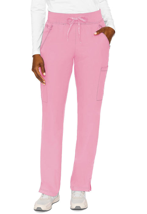 Pink pants are modeled, being displayed straight-on against a white background. A person’s hands are visible in the pockets.
