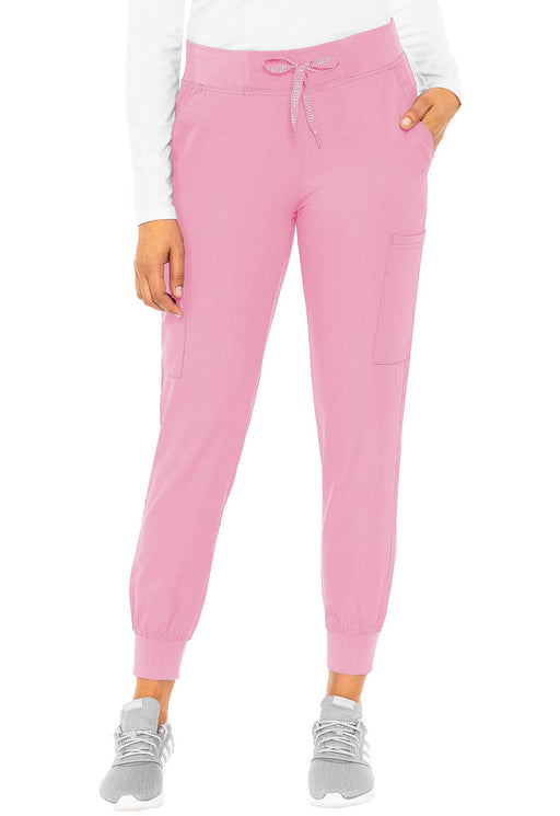 Pink jogger pants with side pockets are being modeled against a white background.