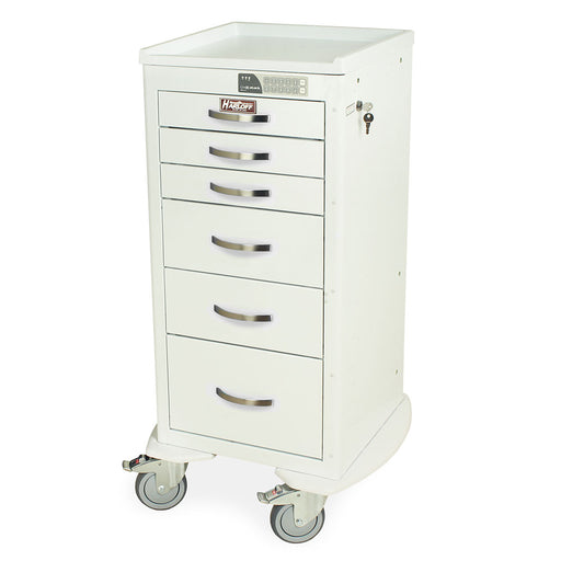 A white, multi-drawer cabinet sits on four wheels. The cabinet is tall and narrow, with several small drawers. It appears to be in a sterile or clinical setting.