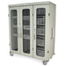 A MEDSTORMAX cabinet stands on wheels; it has three sections with wire baskets and glass doors, providing storage.