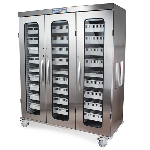 A stainless steel cabinet with three glass doors sits on wheels. Inside are numerous small, light-colored drawers. The cabinet is labeled "MEDSTORMAX".
