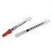 Two Monoject syringes lie on a white background. One syringe has an orange cap. The syringes are shown at a slight angle.