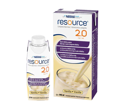 A Nestle Resource 2.0 vanilla nutritional drink is being poured into a glass; a smaller carton and a larger box of the drink are displayed.