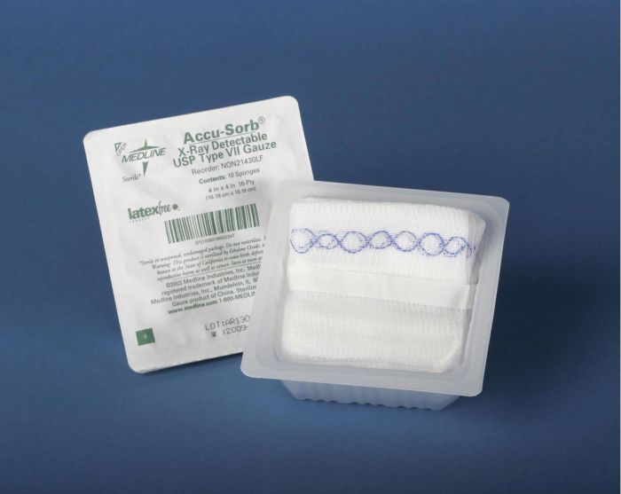 A sterile gauze pad rests in plastic packaging, alongside its informational leaflet. The packaging is displayed against a solid blue background.