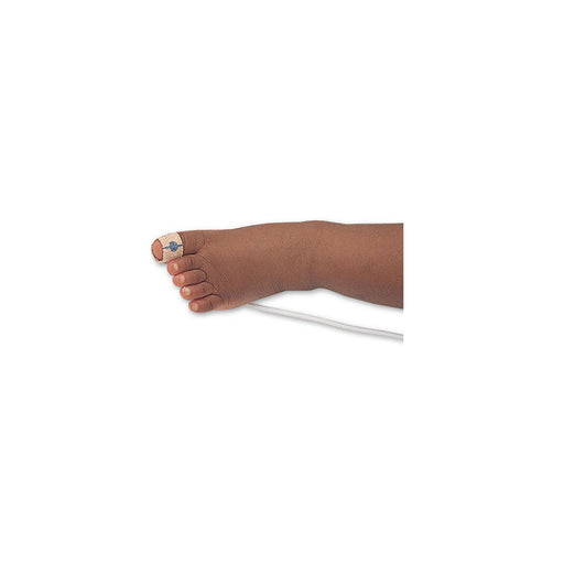 A baby's foot has a sensor taped to its big toe. A white wire extends from the foot on a white background.