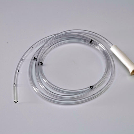 A clear plastic tube, coiled on a light gray surface, features multiple side holes and a white connector.