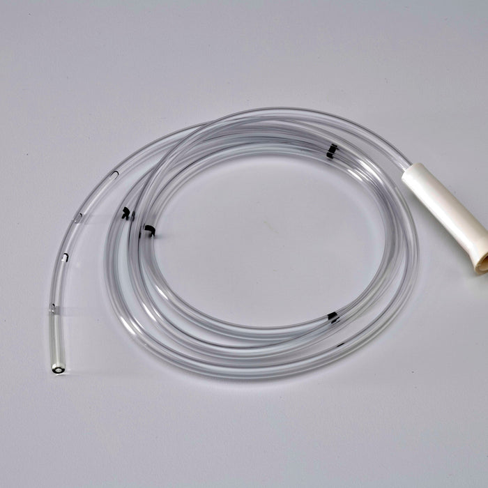A clear plastic tube, coiled on a light gray surface, features multiple side holes and a white connector.
