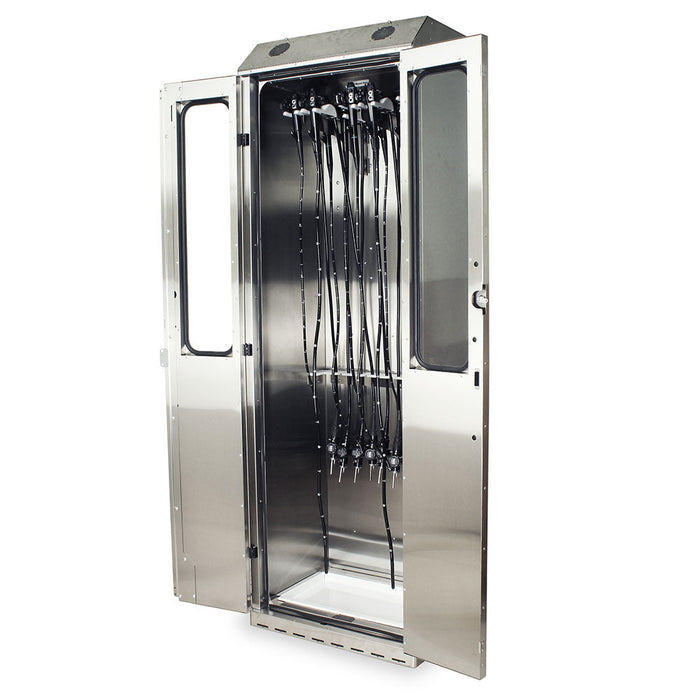 A stainless steel cabinet, with its doors open, houses multiple flexible tubes hanging vertically. A small tray sits at the bottom. The cabinet appears to be in a clean, sterile environment.