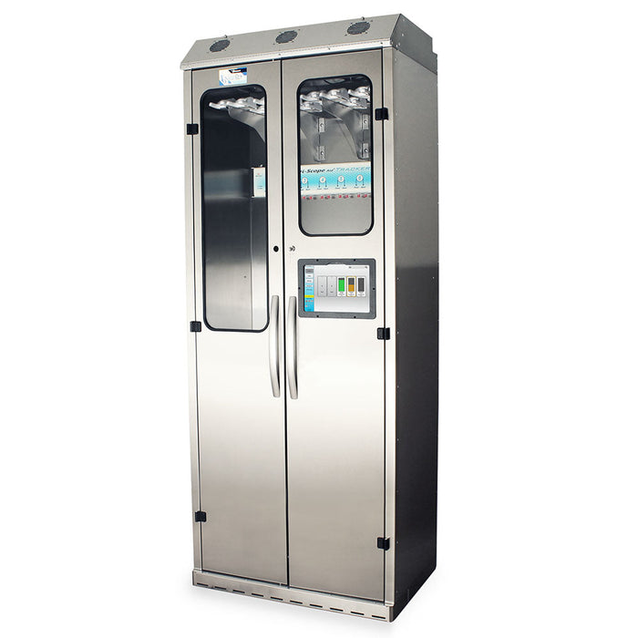 A stainless steel cabinet with glass panels and two doors stands upright. It contains various internal components and possibly stores or dispenses items. The cabinet appears to be in a simple, indoor setting.