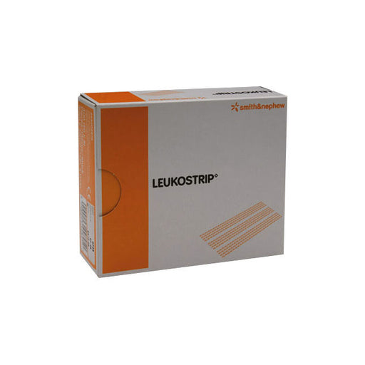 A box of Leukostrip sterile adhesive strips sits on a surface. The box is predominantly white with orange accents and displays the brand name "LEUKOSTRIP" and "smith&nephew".