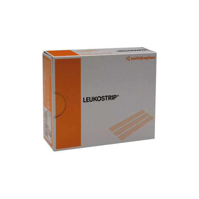 A box of Leukostrip sterile adhesive strips sits on a surface. The box is predominantly white with orange accents and displays the brand name "LEUKOSTRIP" and "smith&nephew".