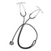 A black stethoscope lies on a white background; its two chest pieces are separated, and the tubing is coiled.