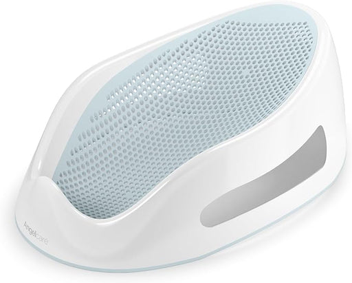 A baby bath sits on a surface. The bath is white with a light-blue perforated insert. Angelcare is printed on the bottom.