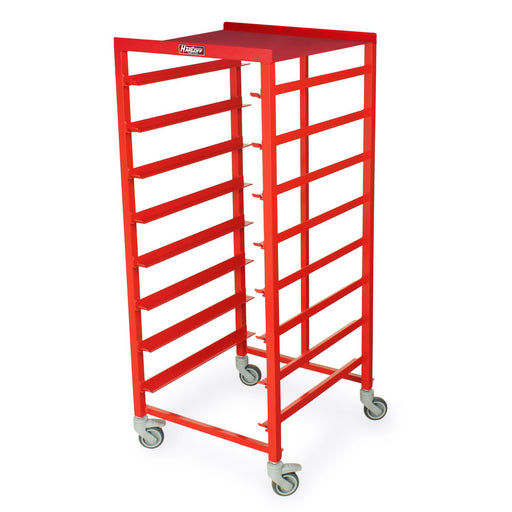 A red metal rack with multiple shelves stands on wheels. It is likely used for storage or transport.