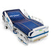 A Stryker hospital bed rests on a white background. The bed's mattress features a blue and orange grid pattern with the Stryker logo.