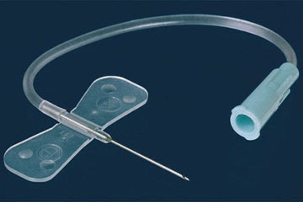 A winged infusion set, ready for insertion, rests on a dark background. The needle is attached to a translucent tube and a flexible, adhesive wing.