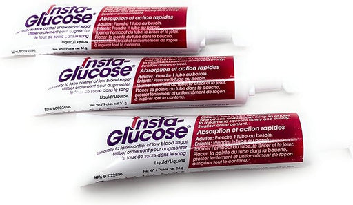 Three tubes of Insta-Glucose gel lie slightly overlapping on a white background. The tubes are predominantly white with purple and red text and graphics.