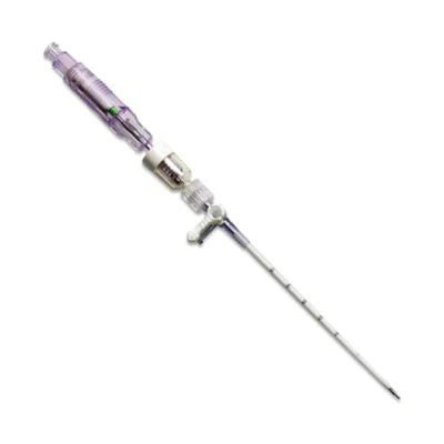 A medical catheter, assembled, lies on a white background.