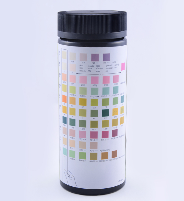 A cylindrical bottle displays a color chart; it shows various color gradients for comparison against a urine sample; the bottle is set against a white background.
