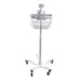 A metal medical basket sits atop a wheeled stand, providing mobile storage in a clinical setting.