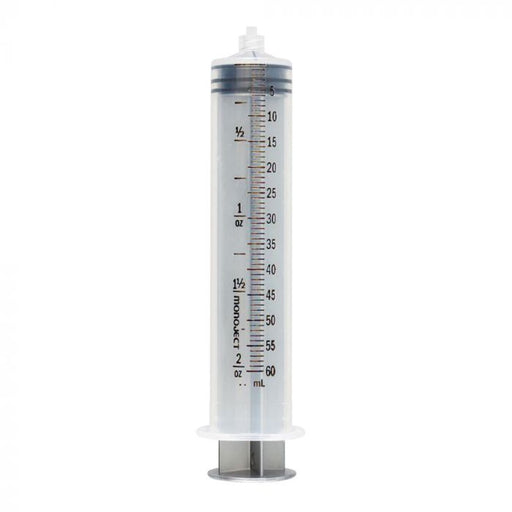 A clear plastic monoject syringe, calibrated in milliliters and ounces, stands upright against a white background.