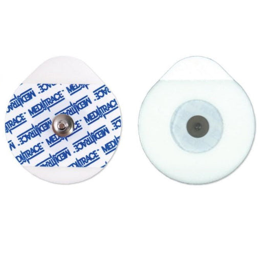 Two round medical electrodes, one with a visible central connector and "MEDITRACE" branding, are displayed on a white background.