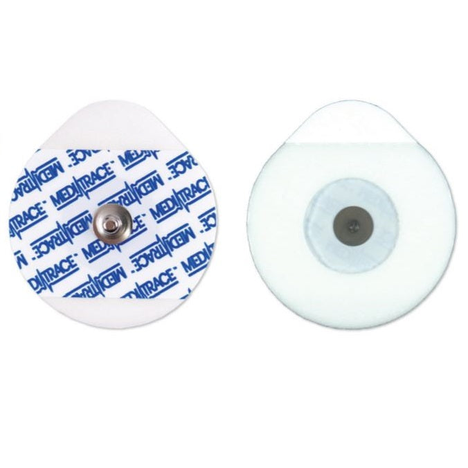 Two round medical electrodes, one with a visible central connector and "MEDITRACE" branding, are displayed on a white background.