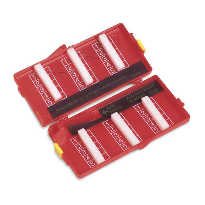 A red plastic case holds used blades; numbered slots organize disposal; a magnetic mechanism facilitates blade removal and safe storage.