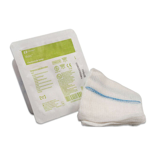 A sterile, x-ray detectable sponge rests beside its packaging. The packaging details product information including the brand name "Vistec" and "X-Ray Detectable Sponges".