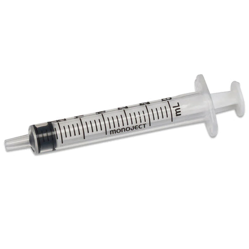 A clear, plastic monoject syringe, rests on a white background. The syringe is 7 mL and displays measurement markings.