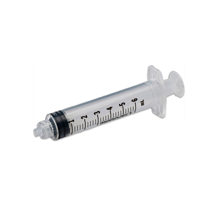 A 6ml Monoject syringe rests on a white background. The syringe is clear plastic with black markings.