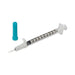 A 1 mL syringe lies on a white background, next to a teal cap. The syringe's needle is visible.